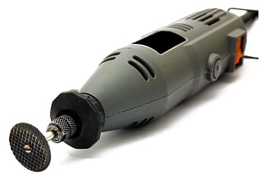 Electrician using a power drill on-site